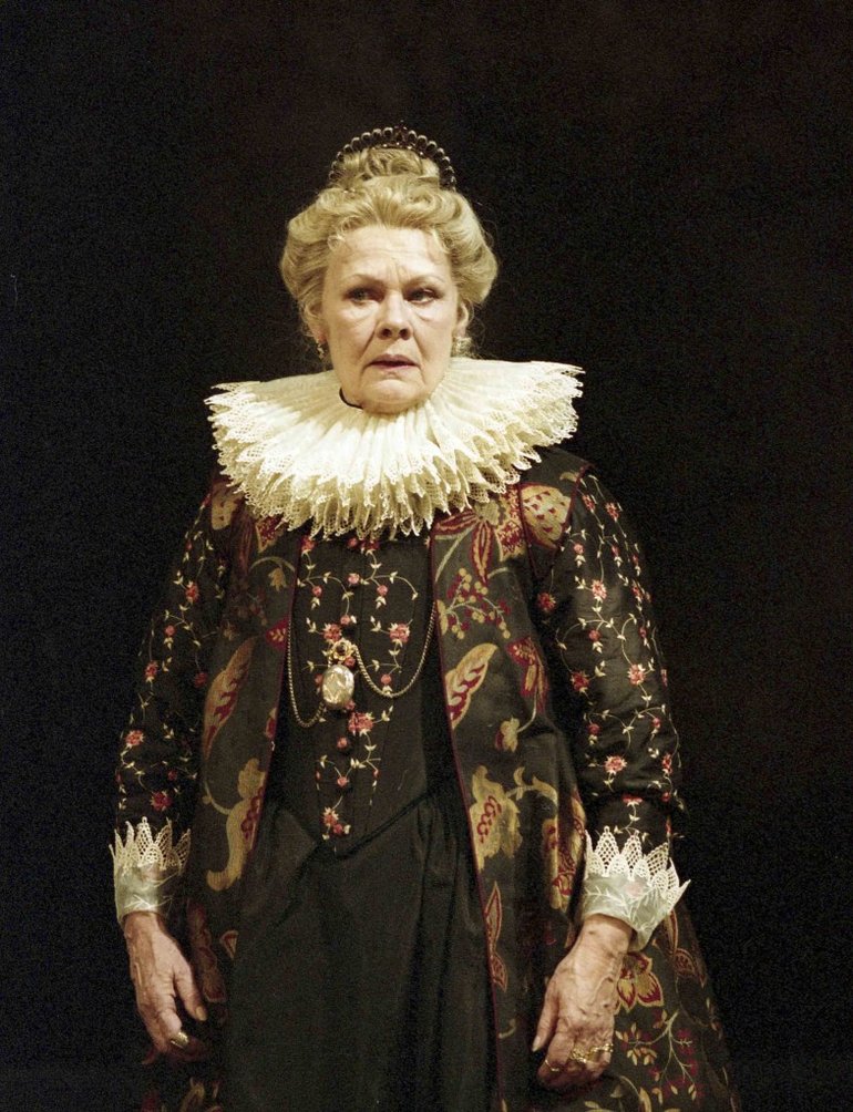 Judi Dench in Greg Doran’s 2003 ‘All’s Well That Ends Well’. Costume consisting of red and black dress with headdress.