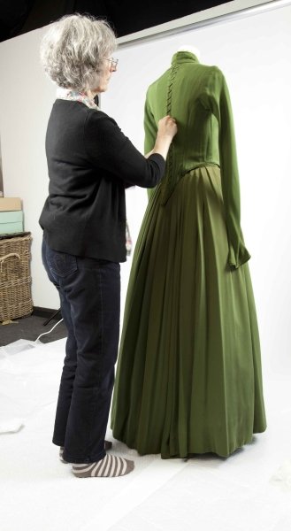 Maggie Wood, Project Officer, preparing a dress for photography