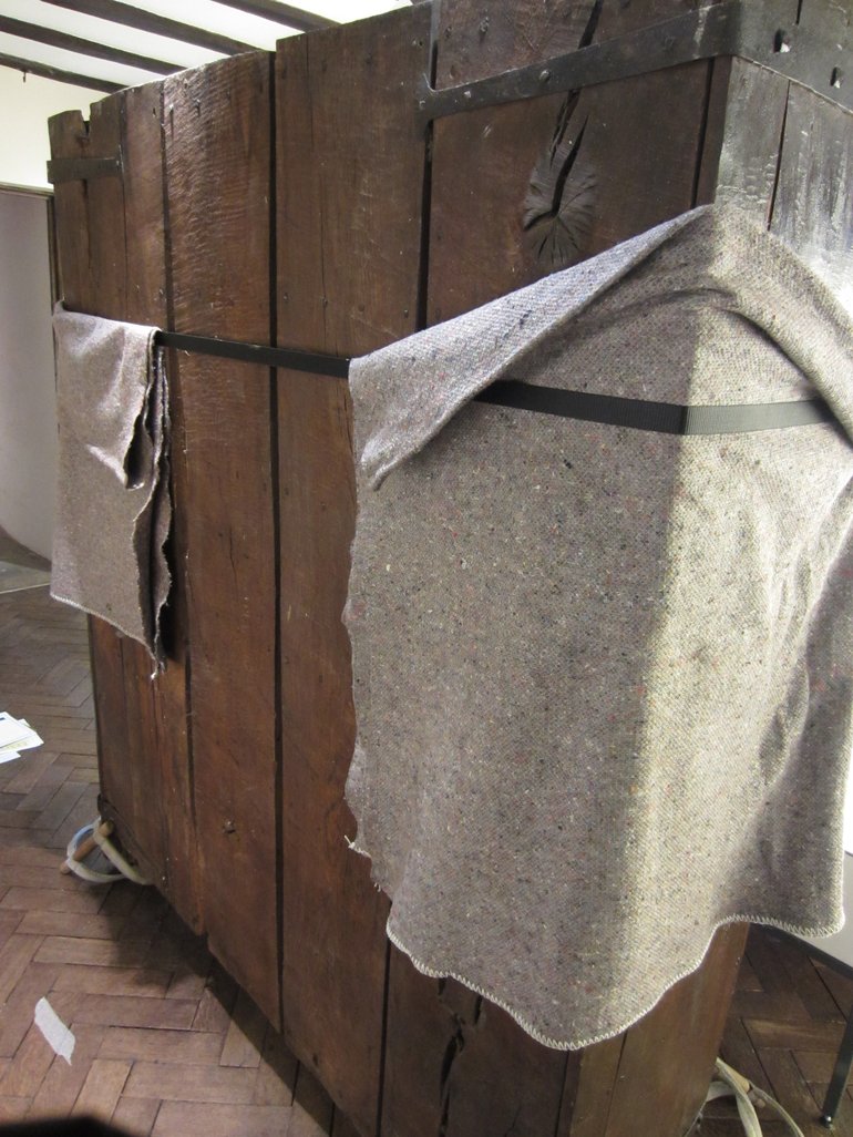 The back of the cubborde, with even more blankets protecting the wood from the securing straps that held the doors closed for the move