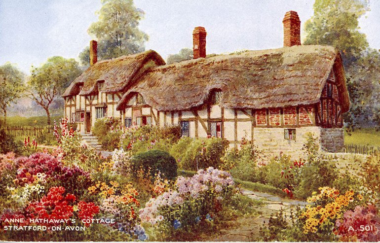 A postcard of the cottage, showing clearly the higher building to the left and the lower roof-line of the rest, and the clear difference of the brick-built final section, compared to the beams of the first two parts. It is built on a slope, which can be seen in the path amid the flowers of the garden.