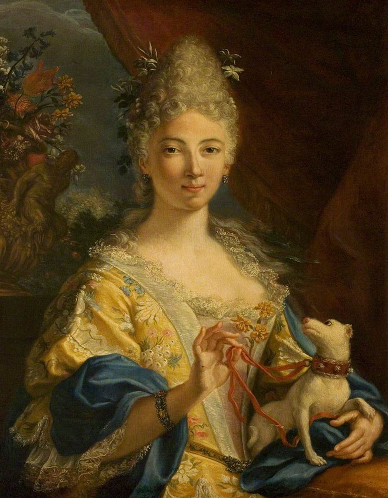 Portrait of an Italian Noblewoman. She is wearing a yellow dress and a powdered wig. There is a small dog on her lap looking up at her face, she holds its leash between the thumb and forefinger of her right hand.