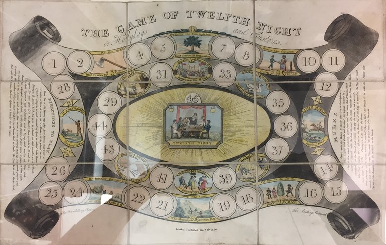 The "board" has a shape curved out top and bottom, curved in at the sides, with an even ellipse within it  Numbered circles from 1 to 44 run round the outside and the ellipse,  some being replaced by images. In the centre is a square-framed image.
