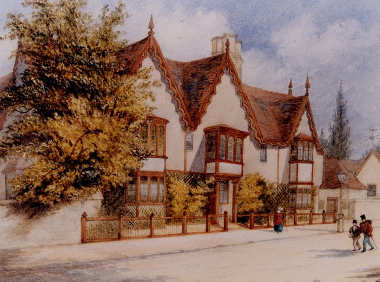 The front of the house has three dormer gables; thee front appears to have been plastered, with very few beams in evidence. Most of the ground floor wall is obscured by shrubbery. The bay windows under the outer gables are for both floors as part of a single structure; the central first-floor bay is supported by pillars, forming a porch over the front door.