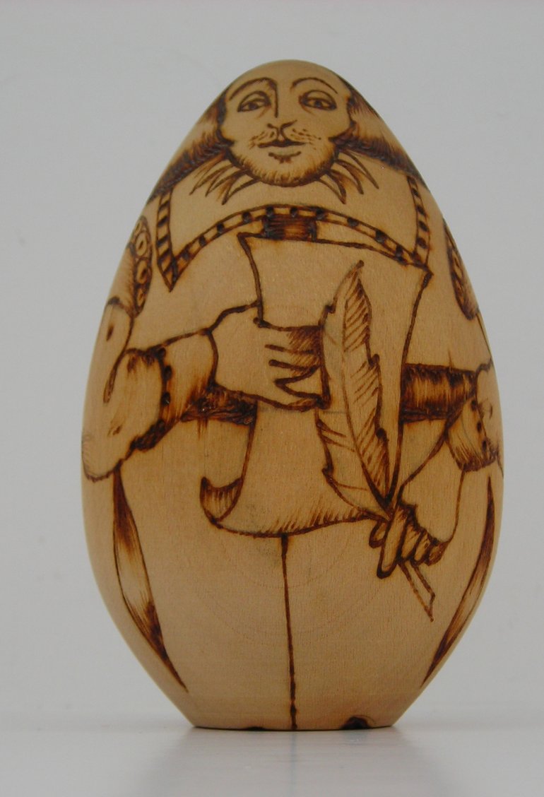 A wooden egg-shaped souvenir model of William Shakespeare